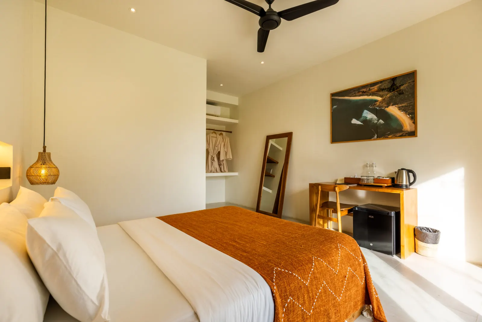 Bedroom with double bed, ceiling fan and wall-mounted desk