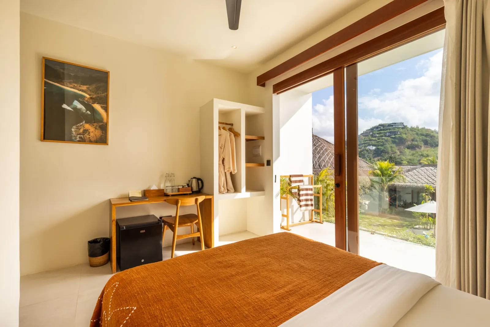 Comfort Room with double bed and large glass doors facing the hills